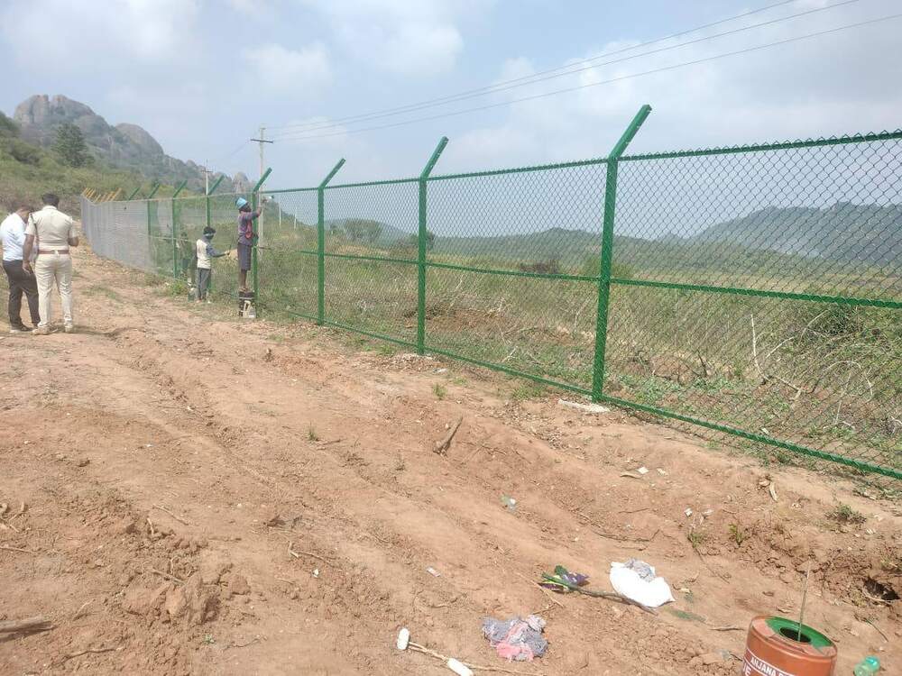Chain link and barbed wire fencing